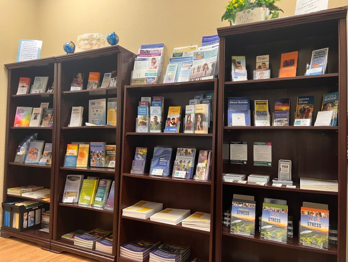 Bookshelves full of brochures and flyers