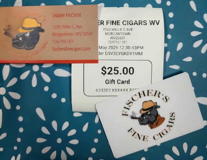 Picture of business card, gift card, and gift card receipt for $25 to Fischer's Fine Cigars.